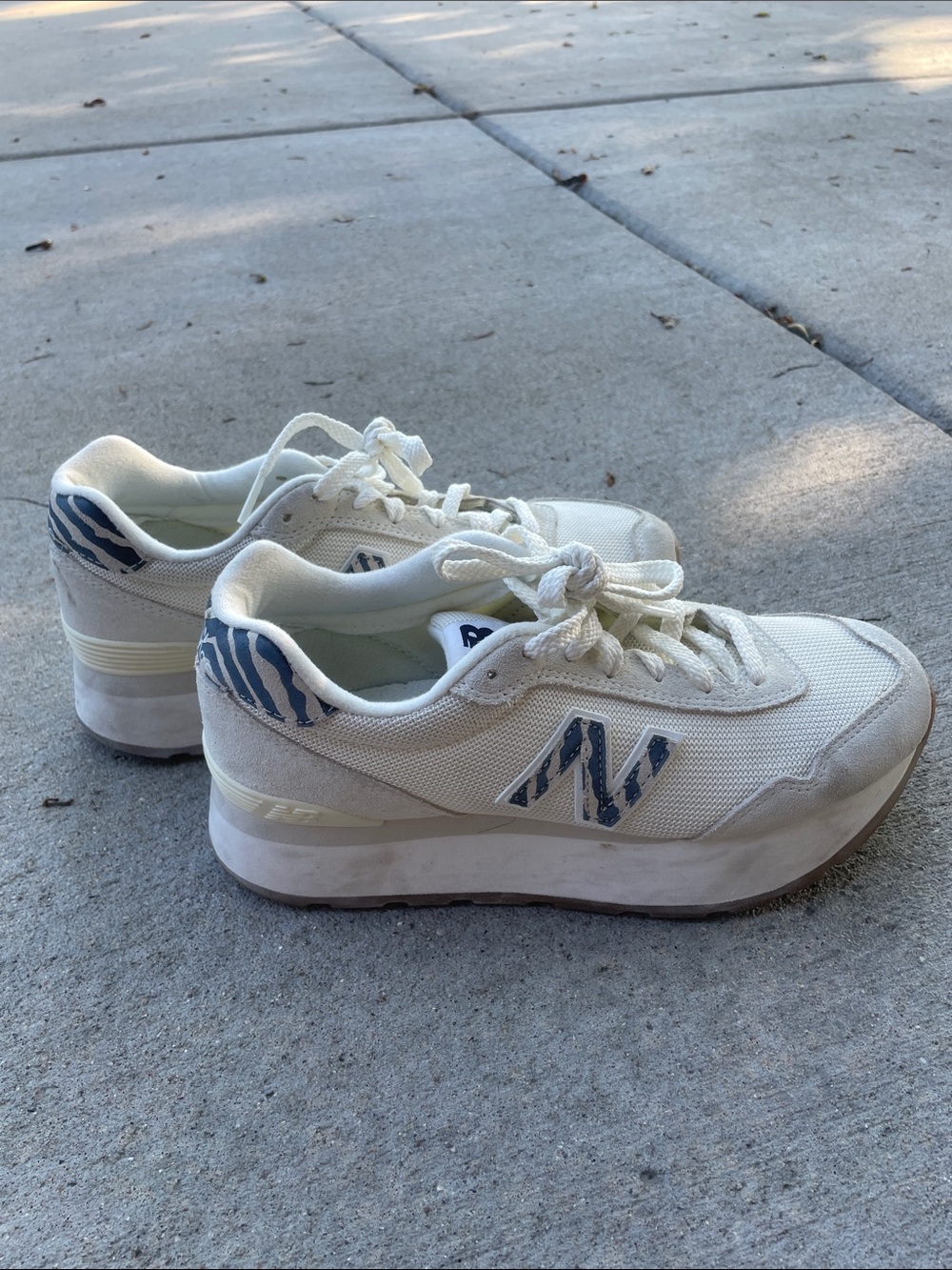 New Balance Cream Sneakers with Blue Zebra Accents